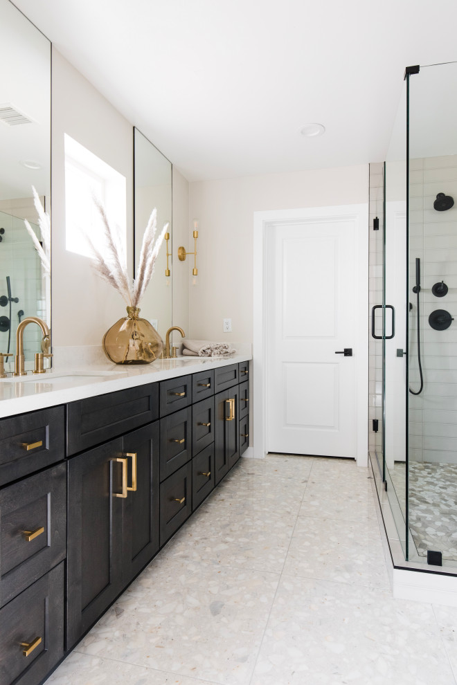 Inspiration for a transitional bathroom in Phoenix with shaker cabinets, black cabinets, a corner shower, gray tile, beige walls, an undermount sink, grey floor, white benchtops, a double vanity and a built-in vanity.