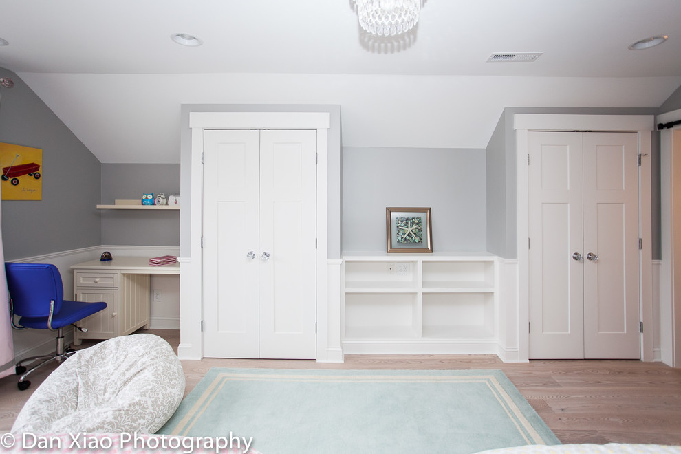 Photo of a mid-sized arts and crafts bedroom in Raleigh with grey walls, light hardwood floors and no fireplace.