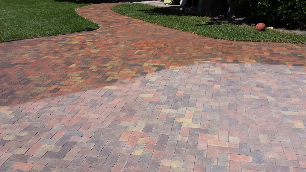 In Progress Brick Paver Driveway Being Sealed with Cobble Loc