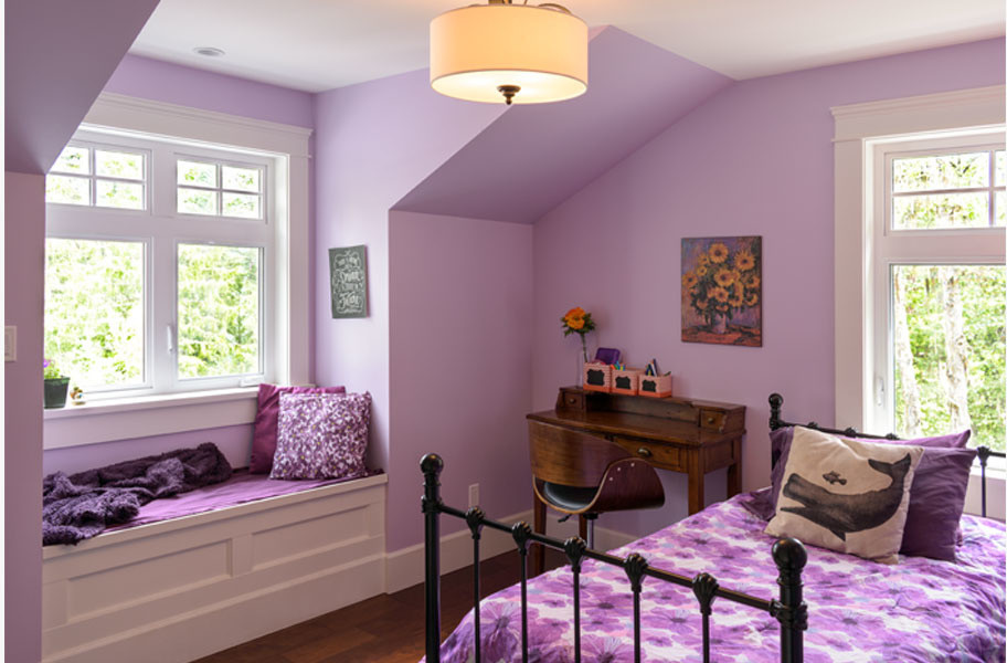 Inspiration for a mid-sized traditional bedroom in Other with purple walls, dark hardwood floors and brown floor.
