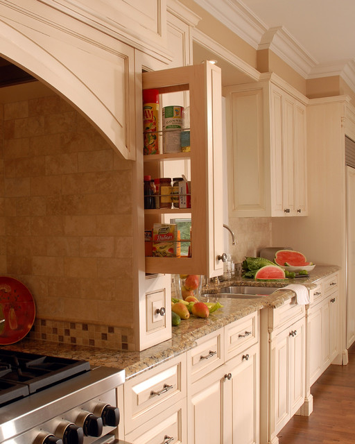 Spice storage in range hood Traditional Kitchen Chicago by Benvenuti and Stein