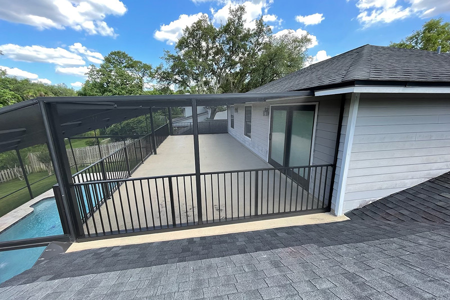 Inspiration for a medium sized classic roof rooftop mixed railing terrace in Orlando with a roof extension.