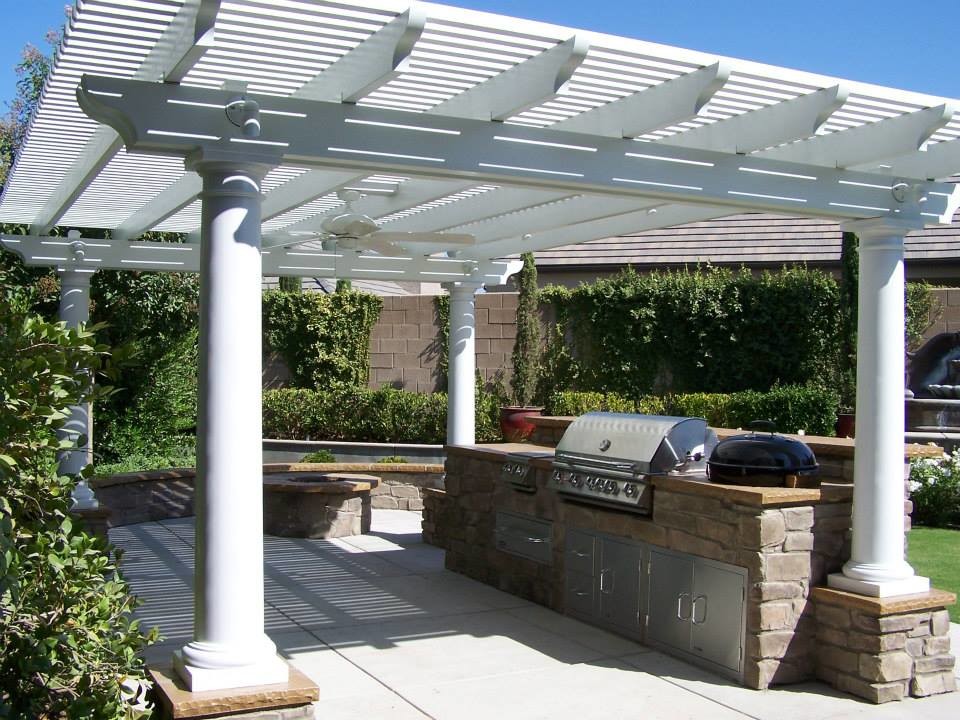 Mid-sized mediterranean backyard patio in Orange County with an outdoor kitchen, concrete slab and a pergola.