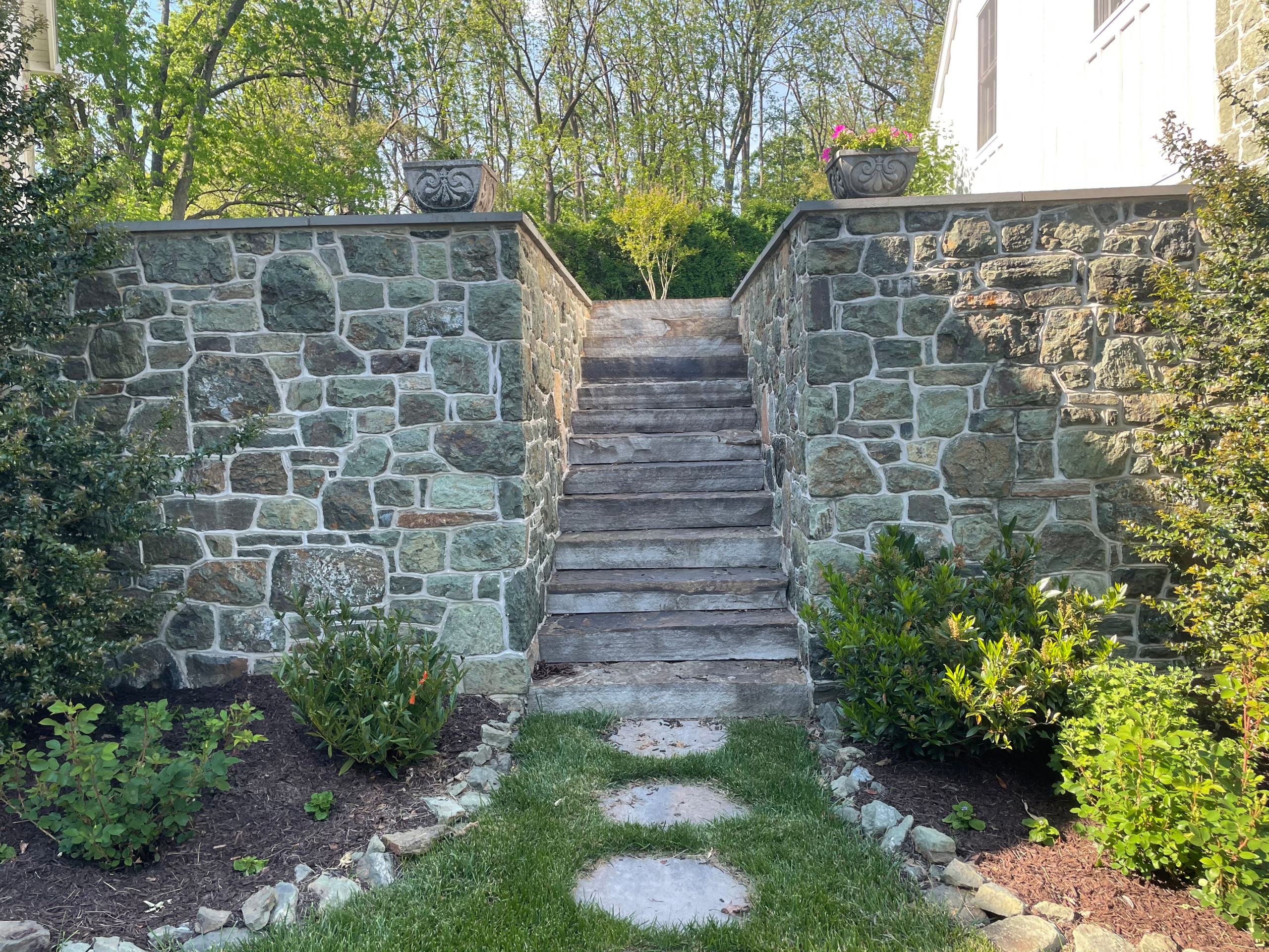 Serpentine stone walls with stone steps