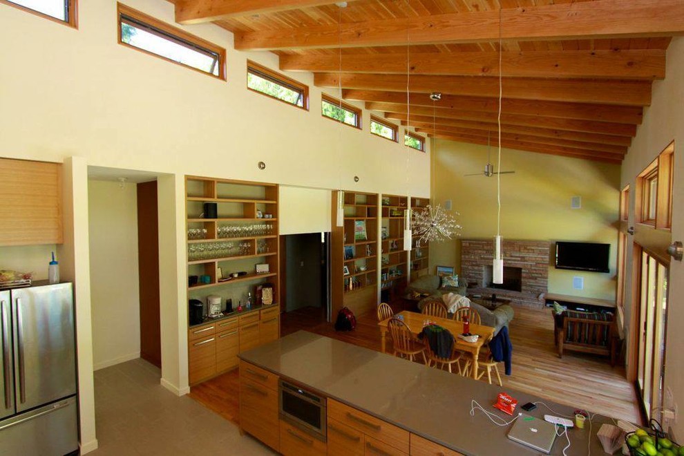 This is an example of a contemporary open concept living room in Seattle.