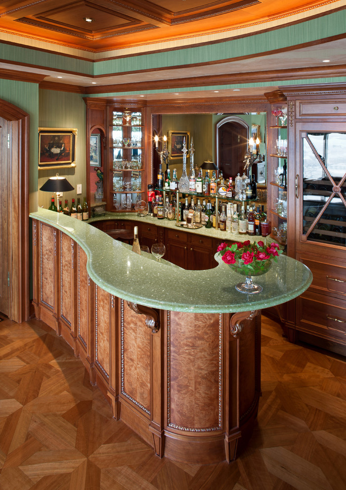 Design ideas for a mediterranean home bar in Milwaukee with brown floor.
