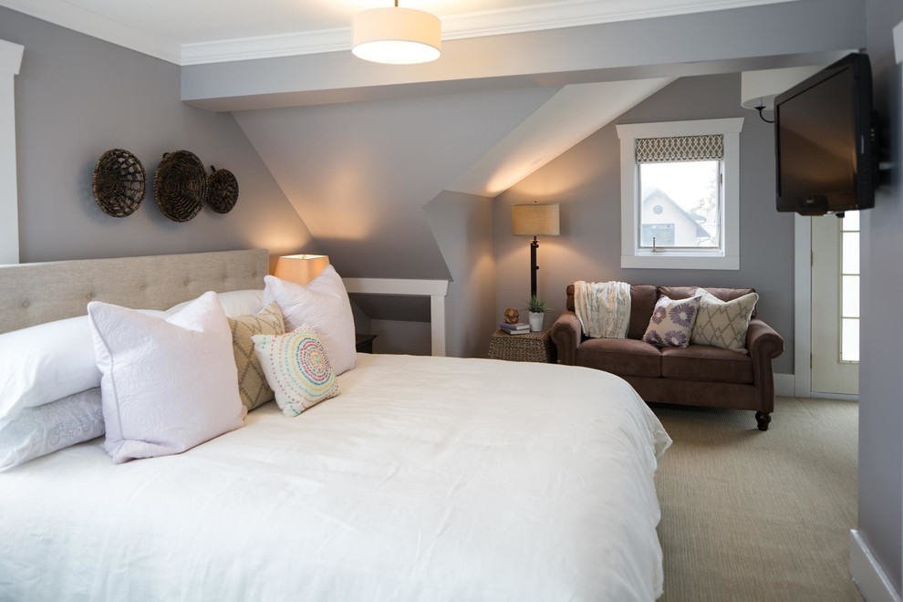 This is an example of a small beach style master bedroom in Calgary with grey walls, carpet and no fireplace.