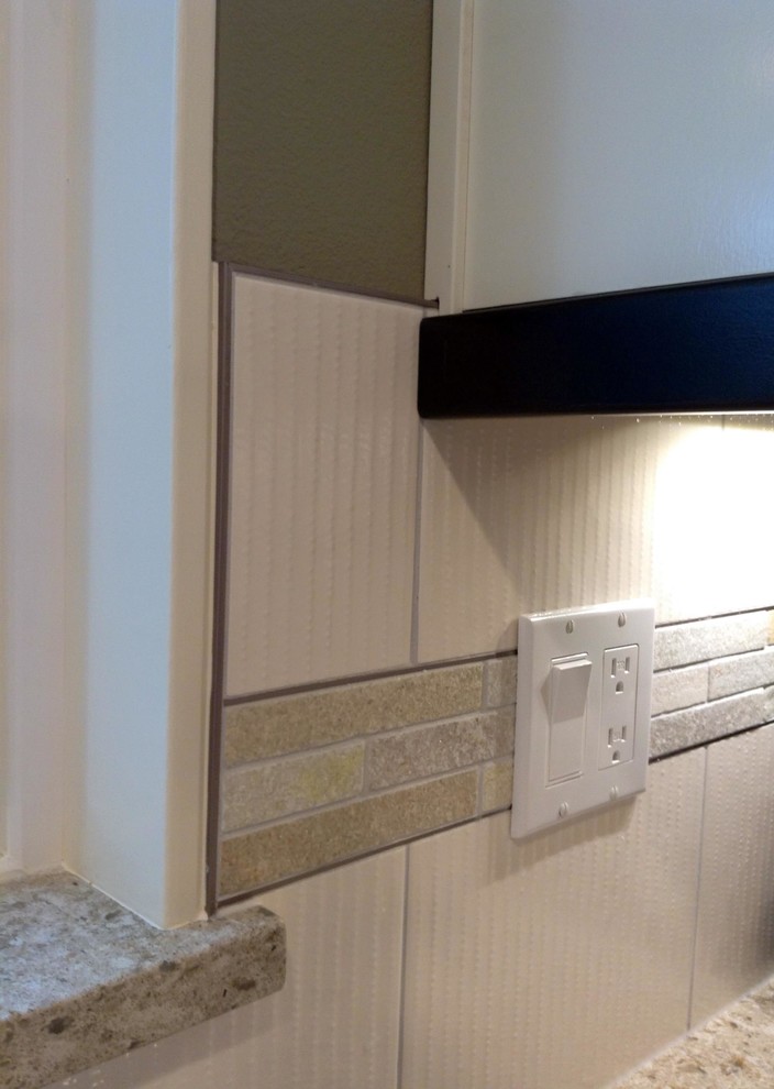 Large transitional l-shaped medium tone wood floor open concept kitchen photo in Seattle with an undermount sink, recessed-panel cabinets, dark wood cabinets, quartz countertops, white backsplash, ceramic backsplash, stainless steel appliances and a peninsula