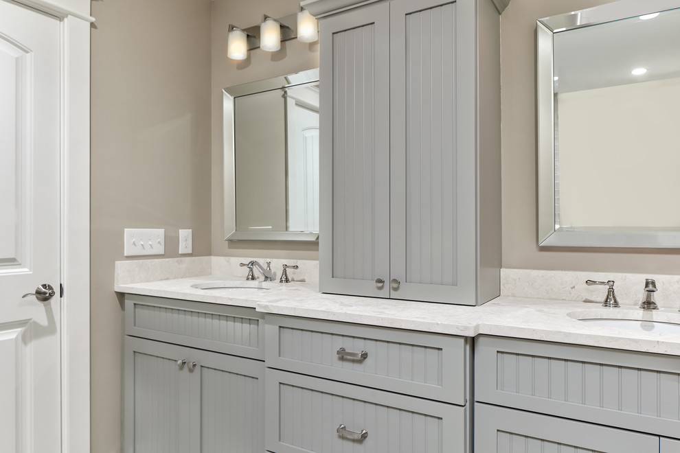 Inspiration for a large transitional master bathroom in Charleston with louvered cabinets, grey cabinets, a one-piece toilet, grey walls, porcelain floors, an undermount sink, engineered quartz benchtops, beige floor, an open shower, beige tile, porcelain tile and a hinged shower door.