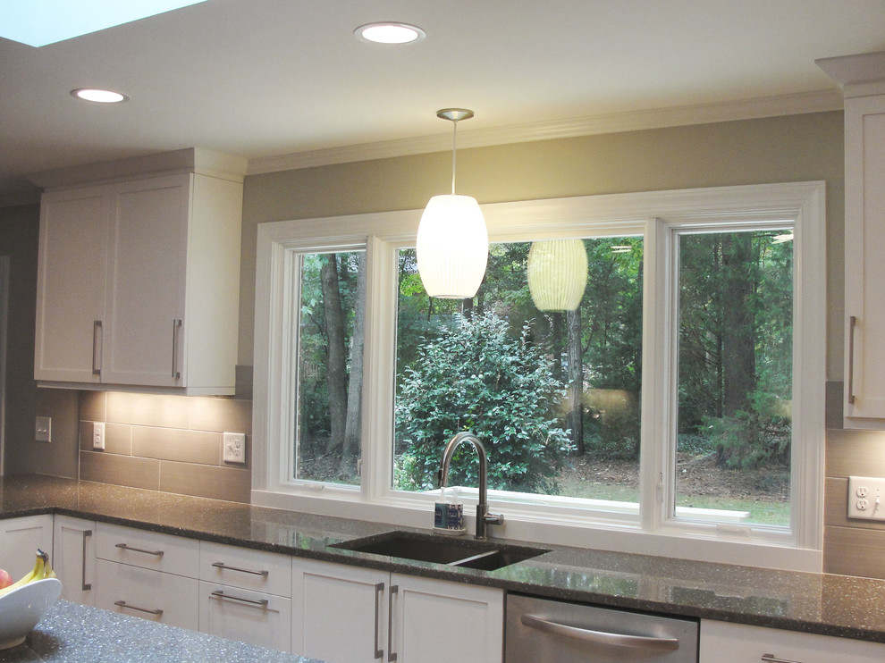 This is an example of a contemporary kitchen in Raleigh.