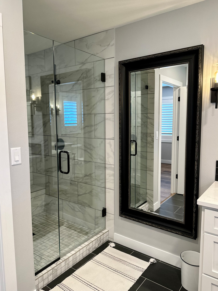 Inspiration for a mid-sized transitional master black tile and subway tile ceramic tile, black floor and double-sink corner shower remodel with recessed-panel cabinets, white cabinets, a two-piece toilet, white walls, an undermount sink, quartz countertops, a hinged shower door, white countertops and a built-in vanity