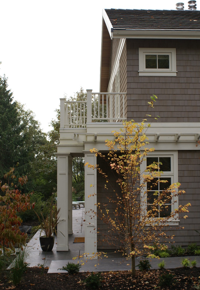 Photo of a large transitional two-storey grey exterior in Seattle with wood siding.
