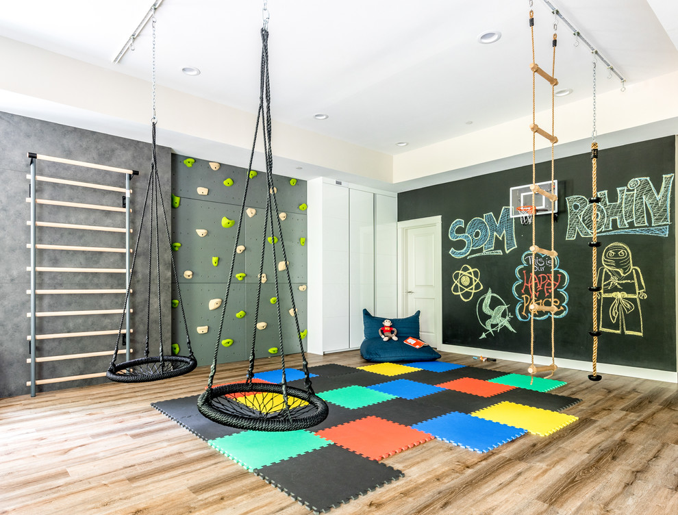 Design ideas for an expansive contemporary gender-neutral kids' playroom for kids 4-10 years old in Seattle with black walls, dark hardwood floors and brown floor.