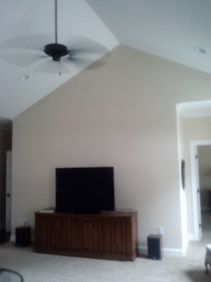 How to decorate a wall in a vaulted ceiling room.