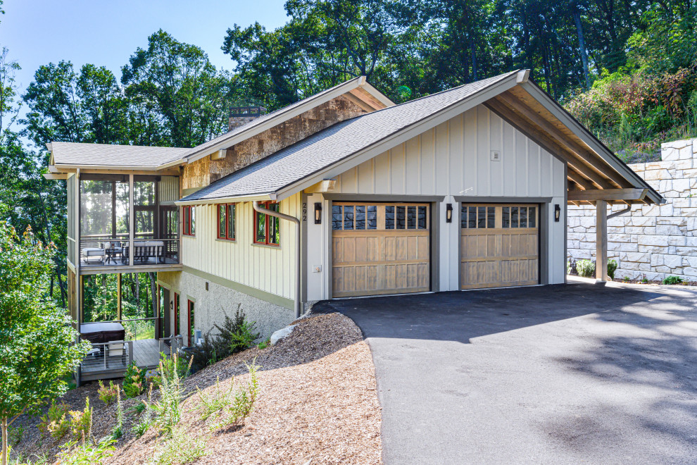 Garage - rustic two-story and attached wood and two-car beige garage idea with a shingle roof