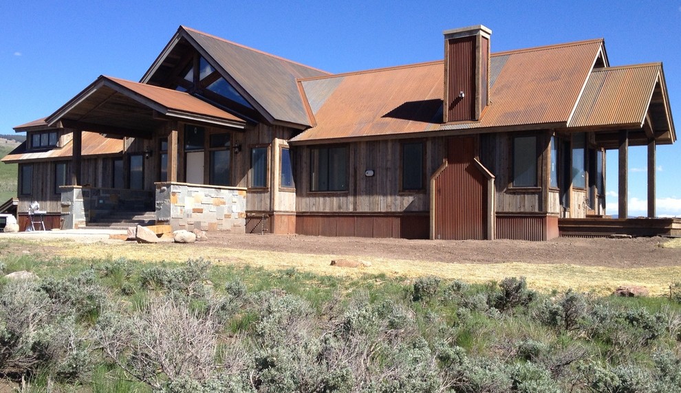 Inspiration for a country brown exterior in Phoenix with metal siding.