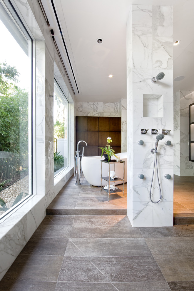 Design ideas for a contemporary bathroom in Orlando with a freestanding tub.