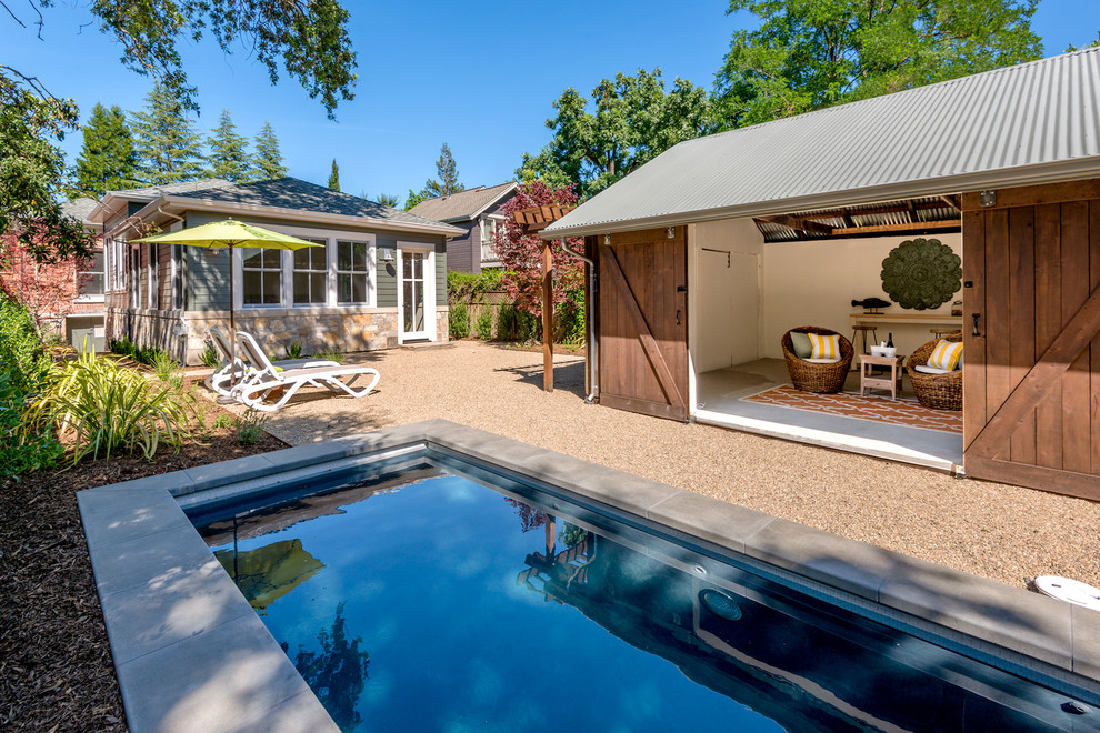 Inspiration for a country rectangular pool in San Francisco with a pool house and gravel.