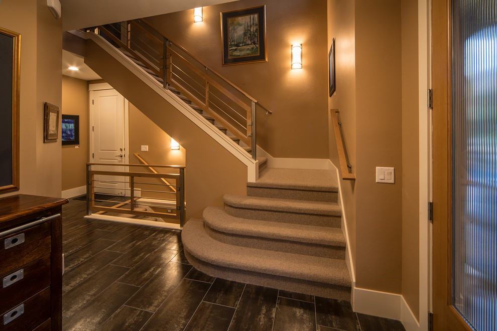Design ideas for a small contemporary carpeted l-shaped staircase in Denver with carpet risers.