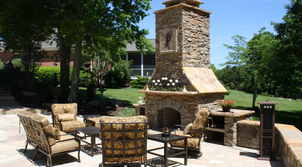 Large mediterranean backyard patio in Other with a fire feature, concrete pavers and no cover.