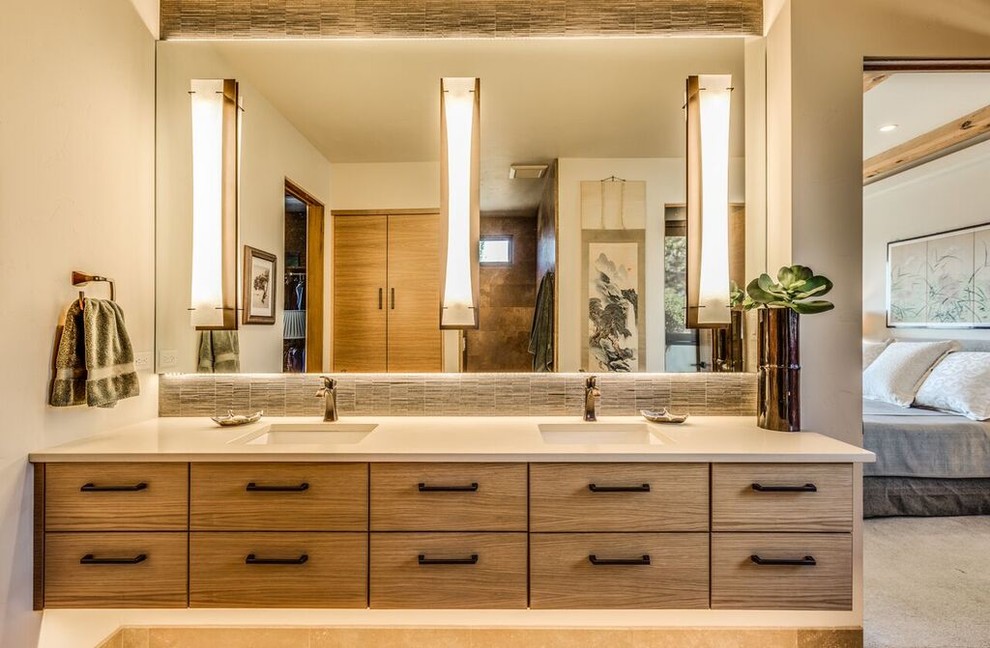 Photo of a mid-sized country master bathroom in Other with flat-panel cabinets, distressed cabinets, beige tile, matchstick tile, beige walls, an undermount sink, solid surface benchtops, an alcove shower, travertine floors, beige floor and an open shower.