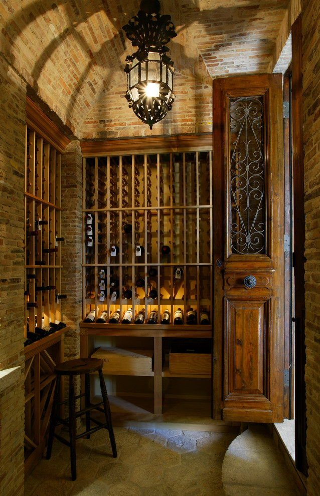 Inspiration for a country wine cellar in Orange County.