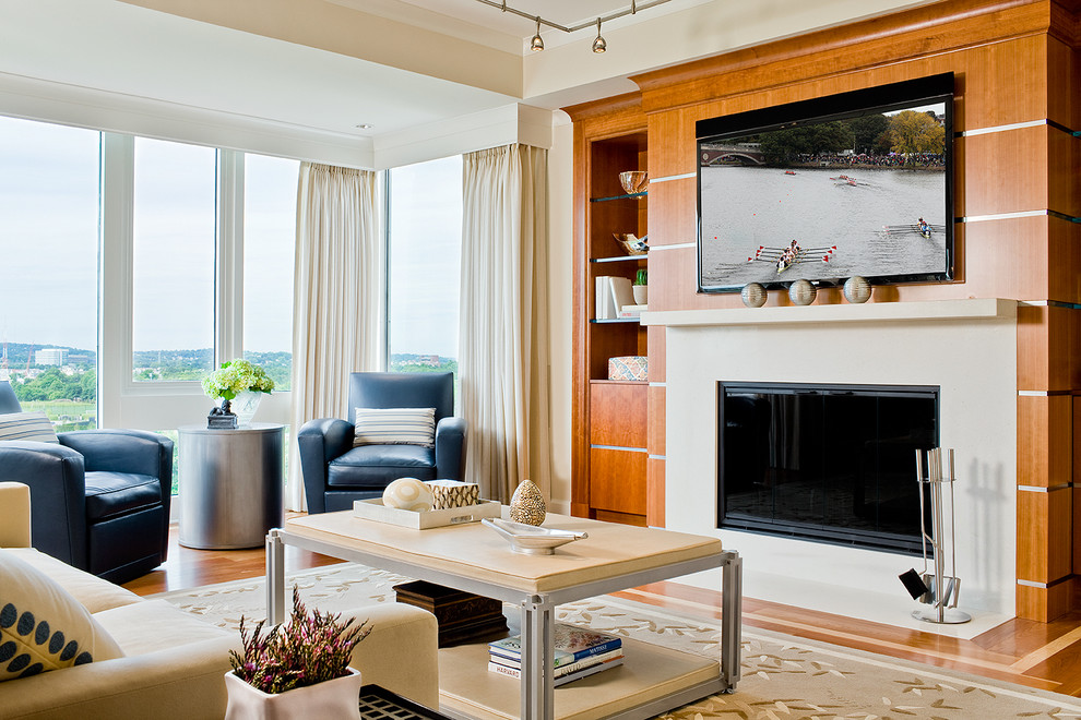 Contemporary living room in Boston with a standard fireplace and a wall-mounted tv.
