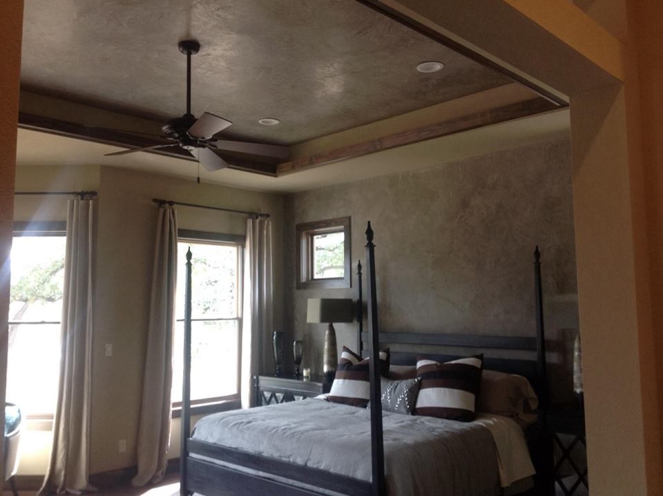 Mid-sized transitional master bedroom in Austin with brown walls and no fireplace.