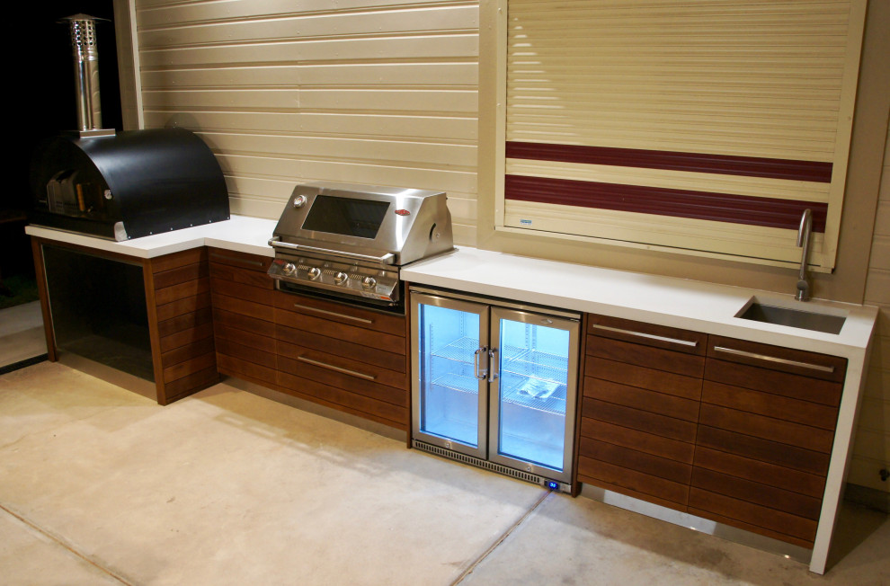 Outdoor Kitchen polished concrete bench tops & reclaimed timber doors
