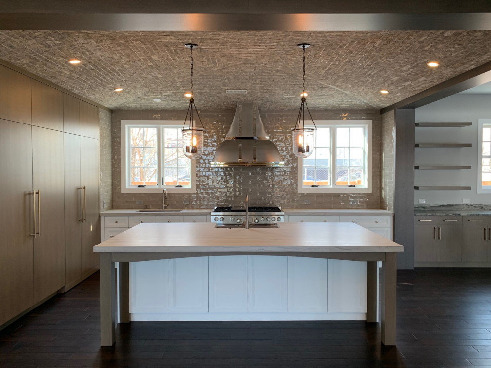 Inspiration for a large eclectic open plan kitchen in Chicago with an undermount sink, flat-panel cabinets, light wood cabinets, quartzite benchtops, grey splashback, cement tile splashback, stainless steel appliances, dark hardwood floors, with island, brown floor, grey benchtop and vaulted.