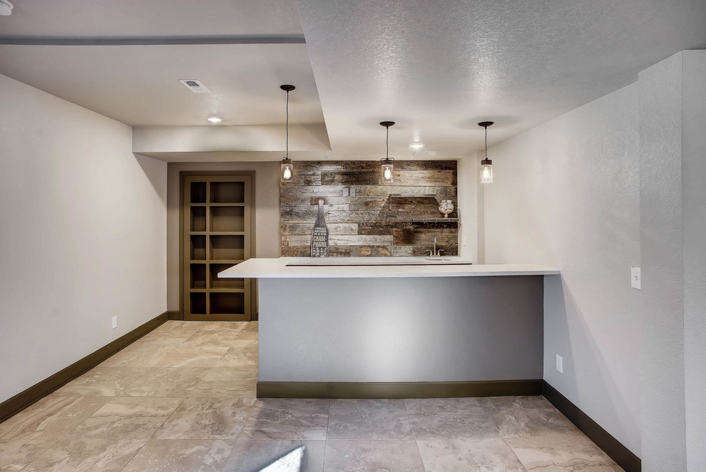 Design ideas for a mid-sized industrial fully buried basement in Denver with white walls, carpet, grey floor, a standard fireplace and a wood fireplace surround.