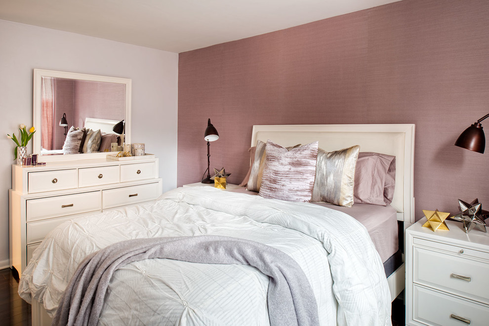 Photo of a transitional bedroom in New York with purple walls, dark hardwood floors and no fireplace.