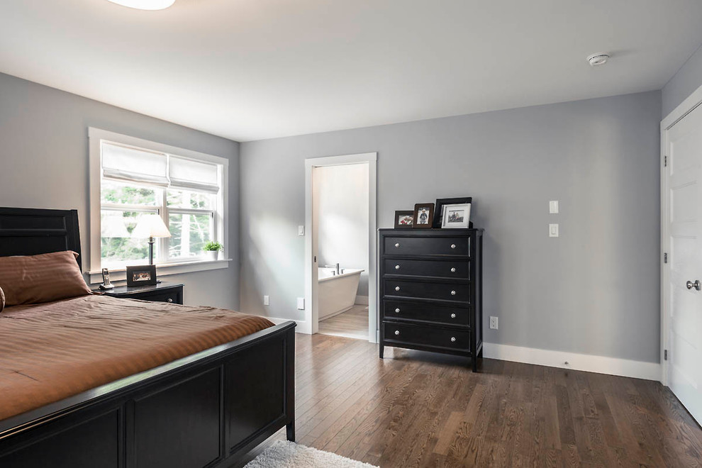 Example of a large transitional master dark wood floor bedroom design with blue walls