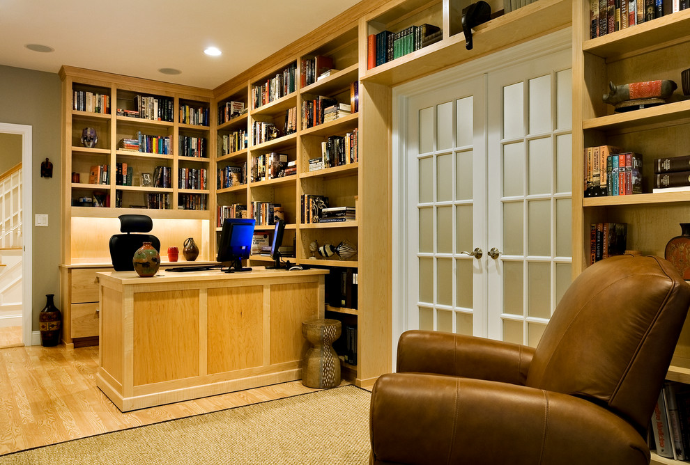Photo of a mid-sized traditional study room in Boston with medium hardwood floors, a freestanding desk and grey walls.