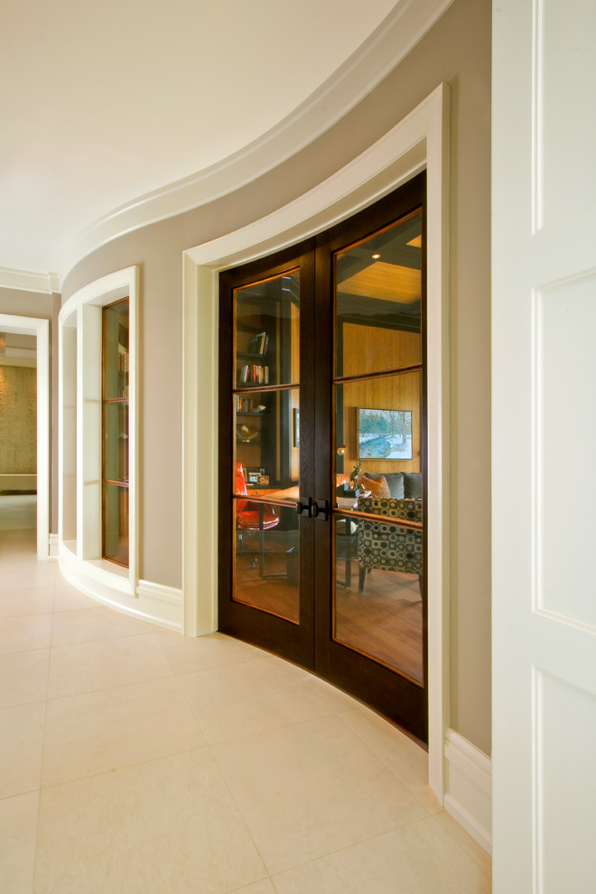 Photo of a large contemporary hallway in Detroit with beige walls and ceramic floors.