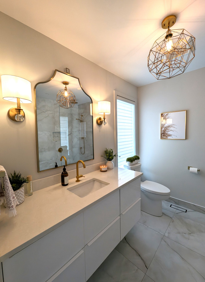 This is an example of a mid-sized contemporary master bathroom in Montreal with flat-panel cabinets, white cabinets, an open shower, a one-piece toilet, beige tile, porcelain tile, beige walls, porcelain floors, an undermount sink, quartzite benchtops, beige floor, an open shower, beige benchtops, a niche, a single vanity and a floating vanity.