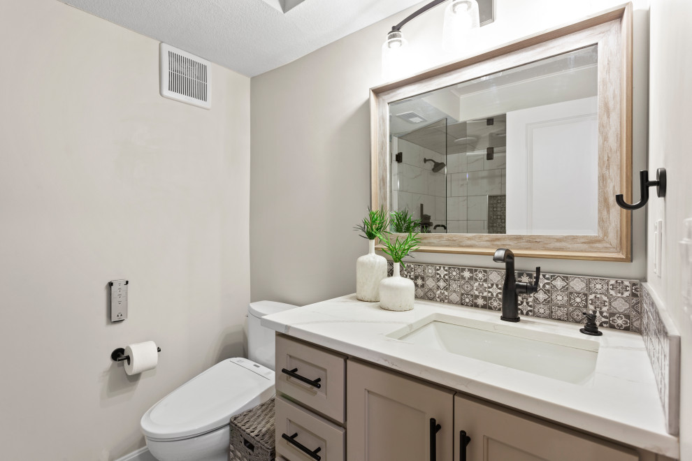 Photo of a medium sized traditional bathroom in Kansas City with glass-front cabinets, white cabinets, an alcove shower, a bidet, white tiles, marble tiles, white walls, a submerged sink, quartz worktops, a hinged door, white worktops, a shower bench, a single sink and a freestanding vanity unit.