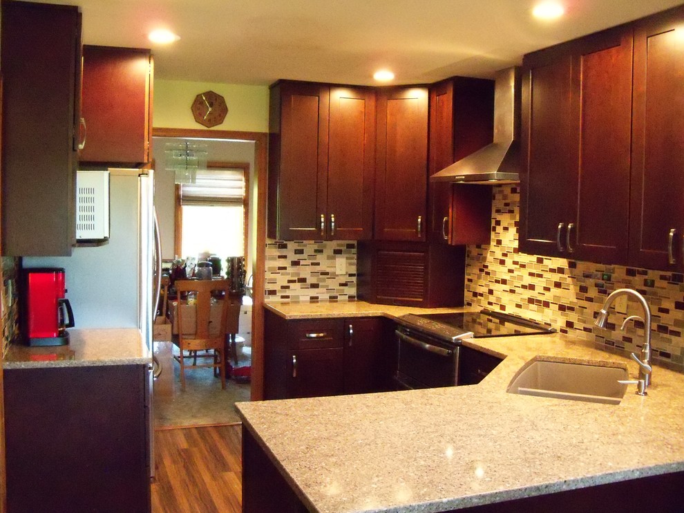Small transitional l-shaped vinyl floor eat-in kitchen photo in Phoenix with an undermount sink, shaker cabinets, dark wood cabinets, quartz countertops, multicolored backsplash, mosaic tile backsplash, stainless steel appliances and a peninsula
