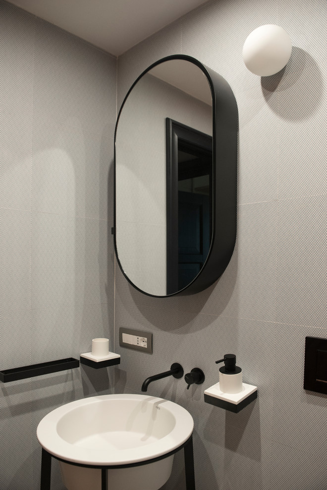 Small contemporary 3/4 bathroom in Rome with open cabinets, black cabinets, an alcove shower, a one-piece toilet, multi-coloured tile, ceramic tile, multi-coloured walls, ceramic floors, a drop-in sink, multi-coloured floor and a sliding shower screen.