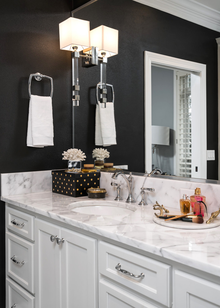 Inspiration for a mid-sized transitional master bathroom in Miami with flat-panel cabinets, white cabinets, a freestanding tub, an alcove shower, a two-piece toilet, black and white tile, mosaic tile, black walls, mosaic tile floors, an undermount sink and marble benchtops.