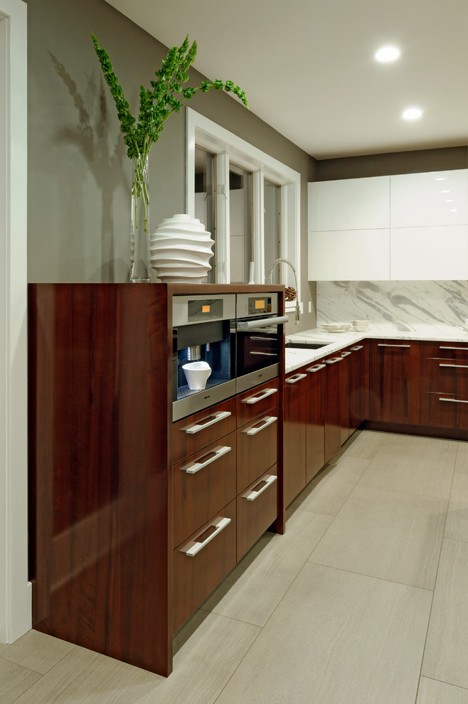 Photo of a large contemporary u-shaped eat-in kitchen in DC Metro with an undermount sink, flat-panel cabinets, dark wood cabinets, marble benchtops, with island, white splashback, stone tile splashback, stainless steel appliances and linoleum floors.
