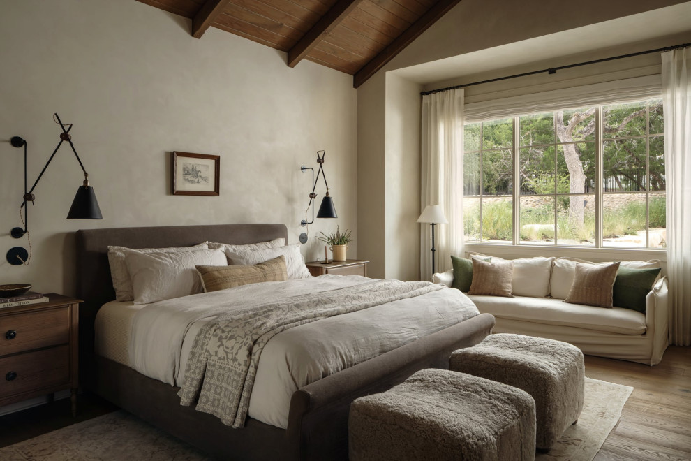 Inspiration for a transitional medium tone wood floor, brown floor, exposed beam, vaulted ceiling and wood ceiling bedroom remodel in Austin with white walls