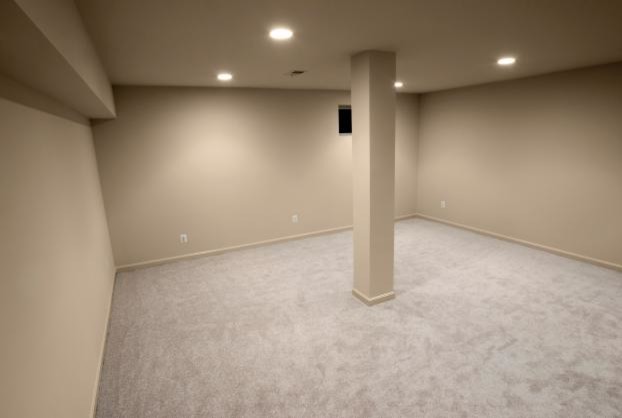 Inspiration for a transitional basement remodel in Calgary with beige walls and no fireplace