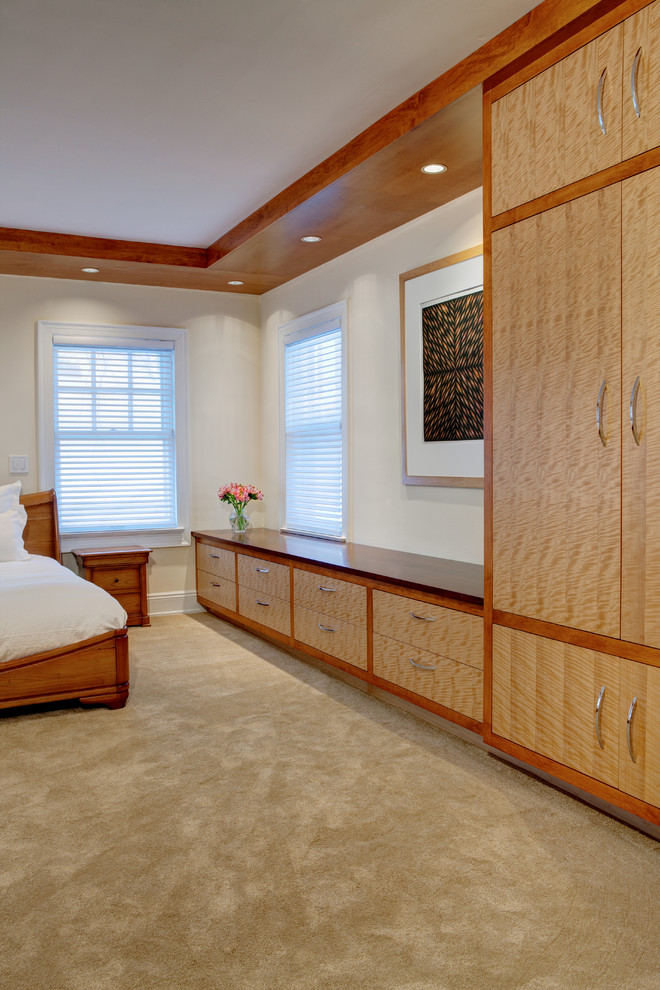 Inspiration for a mid-sized contemporary master bedroom in Cleveland with white walls and carpet.