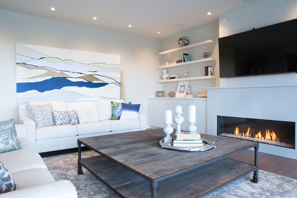 Photo of a contemporary open concept living room in Vancouver with white walls, dark hardwood floors, a stone fireplace surround and a wall-mounted tv.