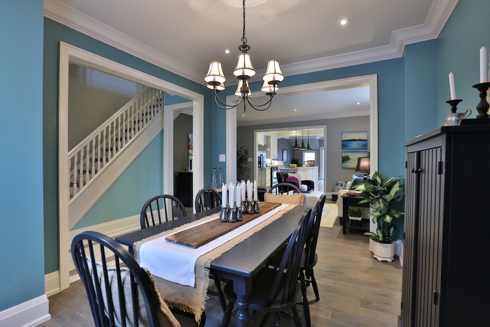 This is an example of a country dining room in Toronto with no fireplace.