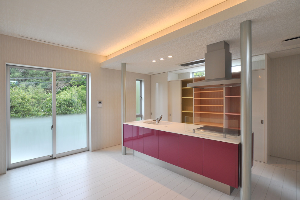 Photo of a modern single-wall open plan kitchen in Other with an integrated sink, flat-panel cabinets, red cabinets, solid surface benchtops, plywood floors, with island and white floor.