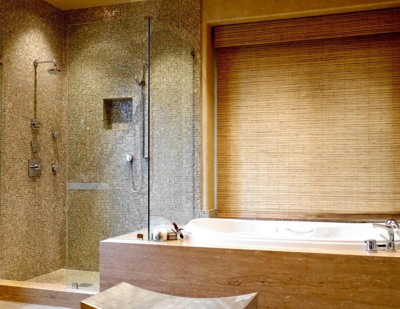 This is an example of a contemporary master bathroom in Los Angeles with a drop-in sink, flat-panel cabinets, light wood cabinets, a drop-in tub, a corner shower, brown tile and mosaic tile.