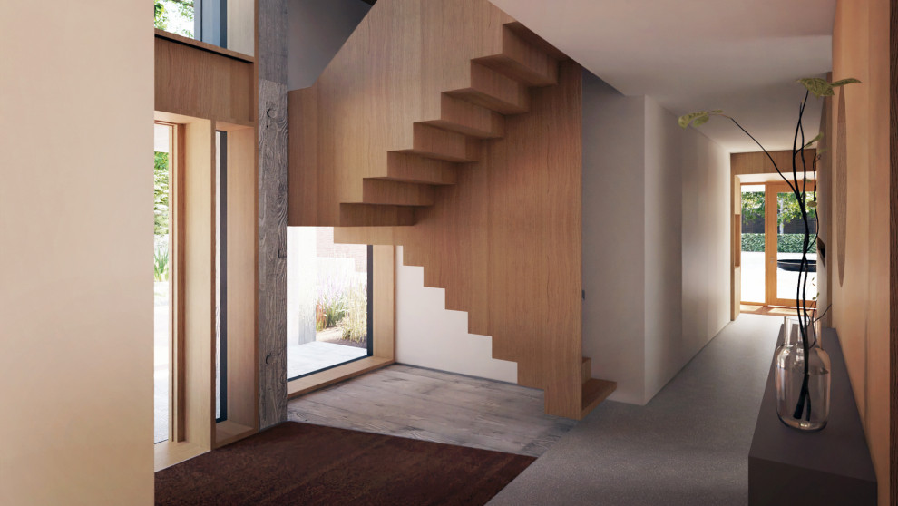 Inspiration for a medium sized contemporary wood u-shaped wood railing staircase in Surrey with wood risers.
