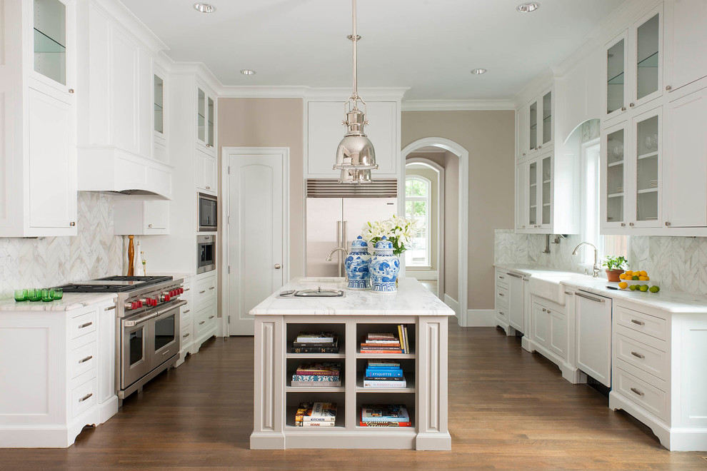 Inspiration for a traditional kitchen in Dallas with a farmhouse sink, glass-front cabinets, white cabinets, multi-coloured splashback, stainless steel appliances, medium hardwood floors and with island.